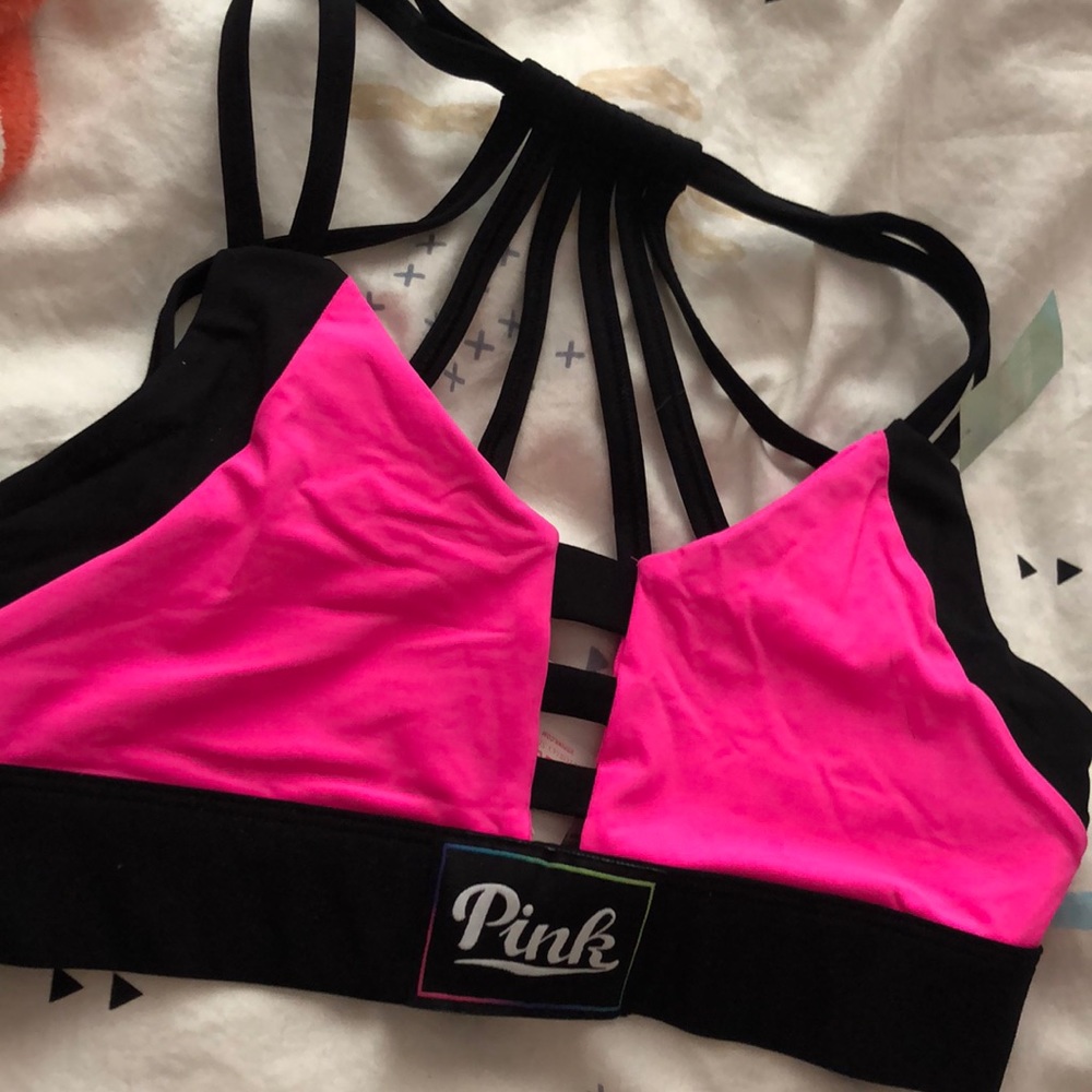 A bright pink Victoria secret workout bra
